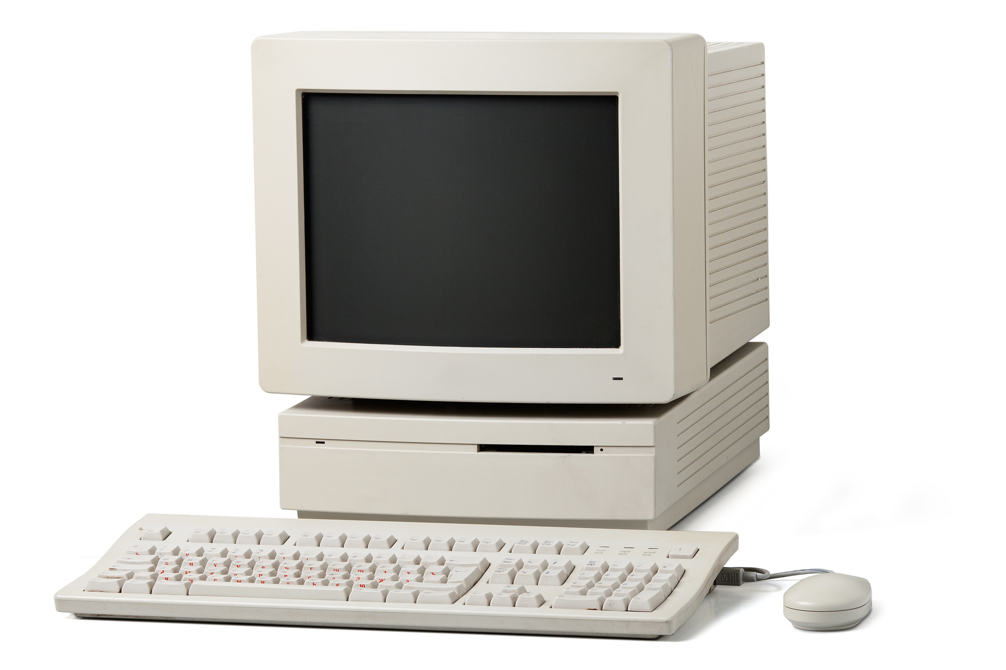Old personal computer. The system unit, monitor, keyboard and mouse isolated on white background.